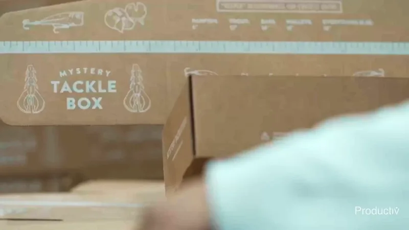 Mystery Tackle Box subscription cartons on a Productiv packout line